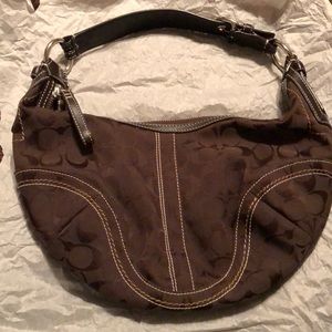 Chocolate brown Coach purse.